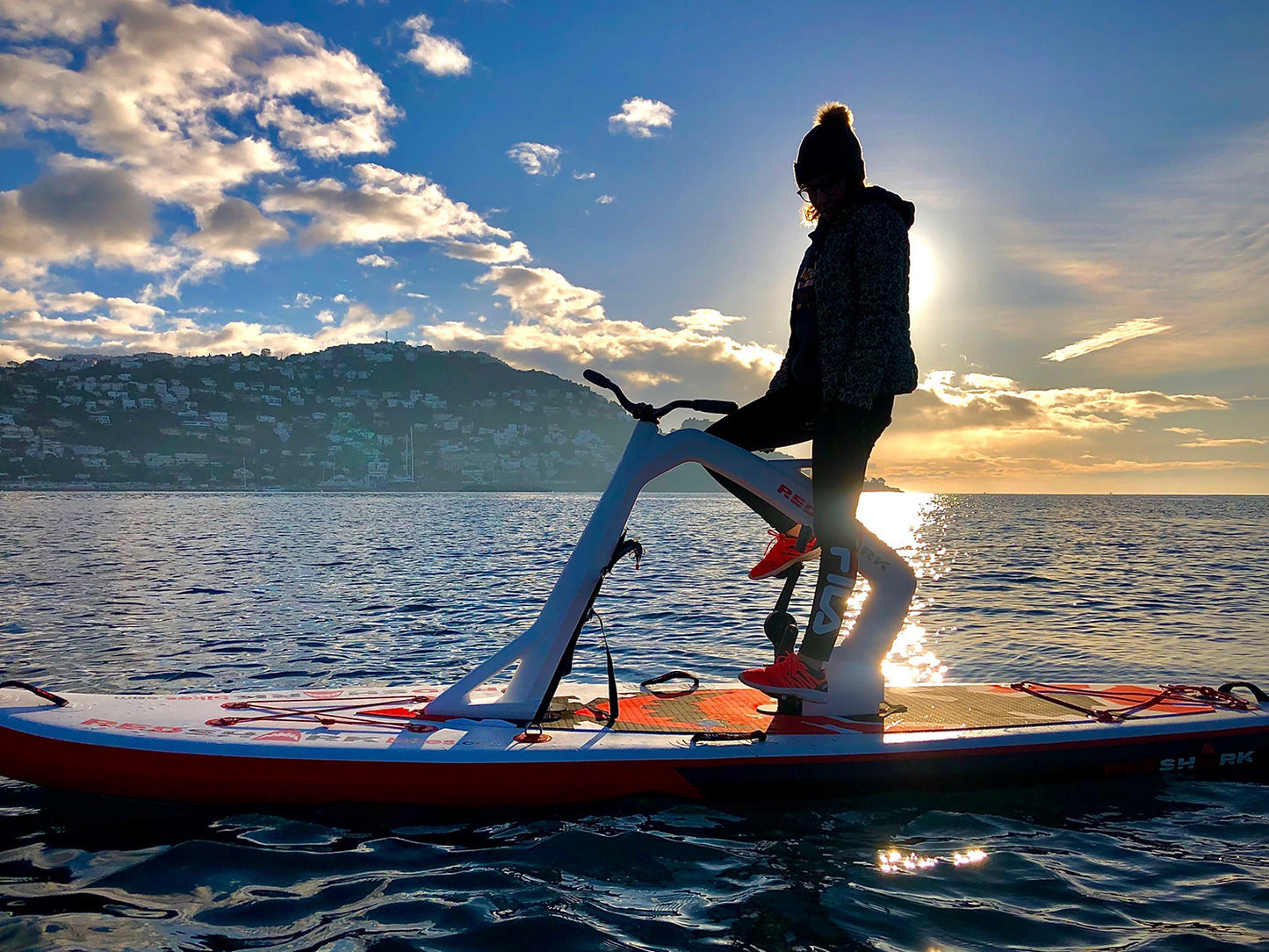 Pedal-powered Surf-Cycle water bike rental on Flathead Lake—delivered to lake cabins, docks, and Montana waterfronts for family-friendly cruising fun. Rent at MontanaBoarders.com