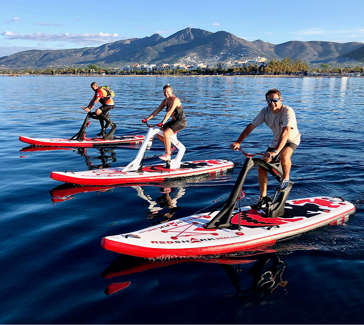 Pedal-powered Surf-Cycle water bike rental on Flathead Lake—delivered to lake cabins, docks, and Montana waterfronts for family-friendly cruising fun. Rent at MontanaBoarders.com