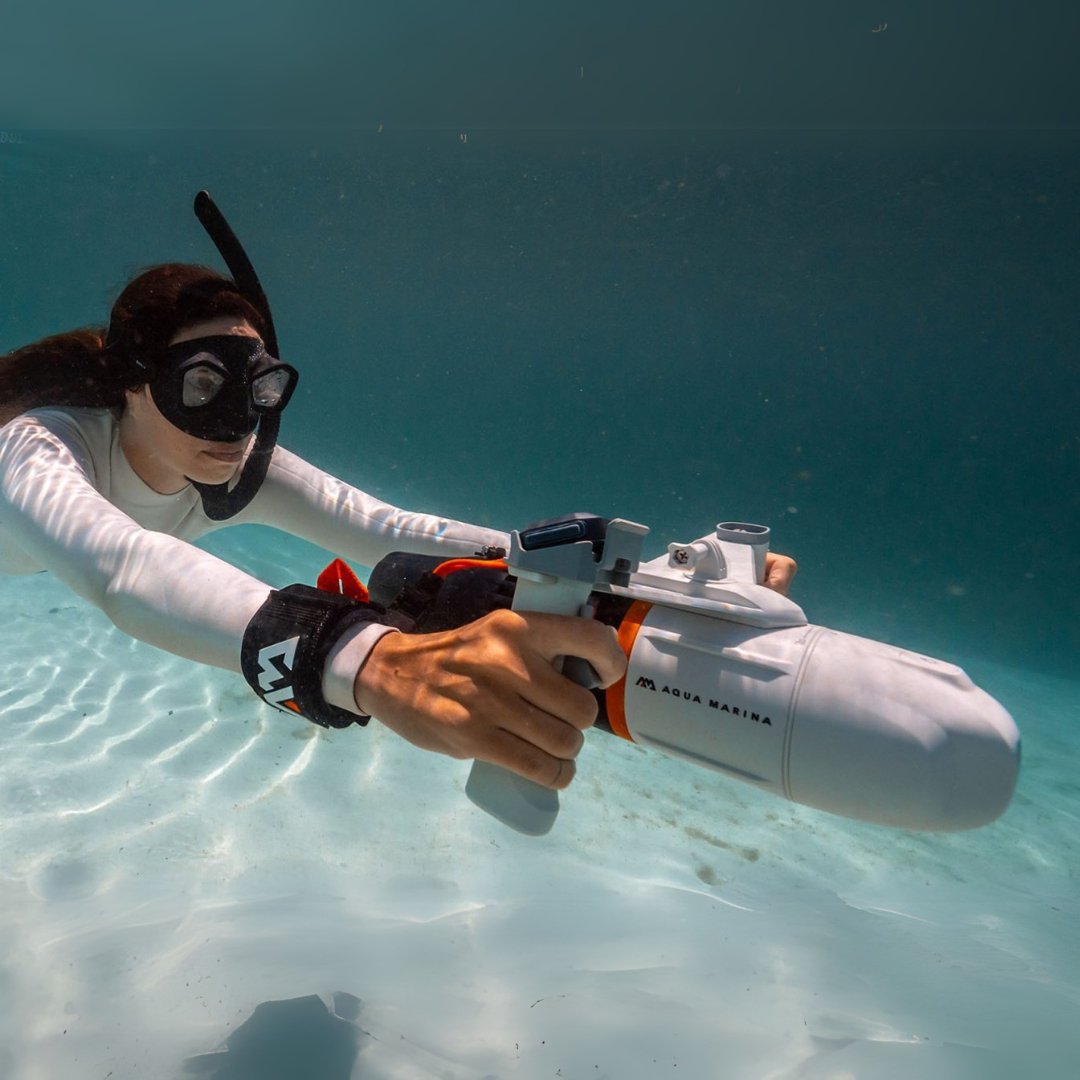 Underwater electric power fin boosting a swimmer across Flathead Lake. Compatible with paddleboards, kayaks, and swim harness kits. Rent from MontanaBoarders.com or buy at E-Boarders.com.