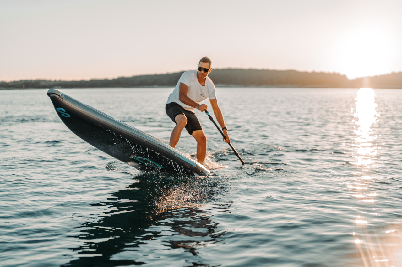 SipaBoards self-inflating electric paddleboard rental with built-in propulsion and Bluetooth remote, delivered to Flathead Valley lakefronts.