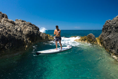 Paddler on inflatable paddleboard isup Drift by Aqua Marina with fishing pole. Rent fishing gear from MTBoarders.com with delivery included. Or buy now from e-boarders.com