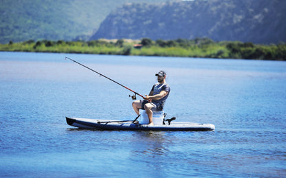 Fisherman on inflatable paddleboard isup Drift by Aqua Marina with fishing pole. Rent fishing gear from MTBoarders.com with delivery included. Or buy now from e-boarders.com