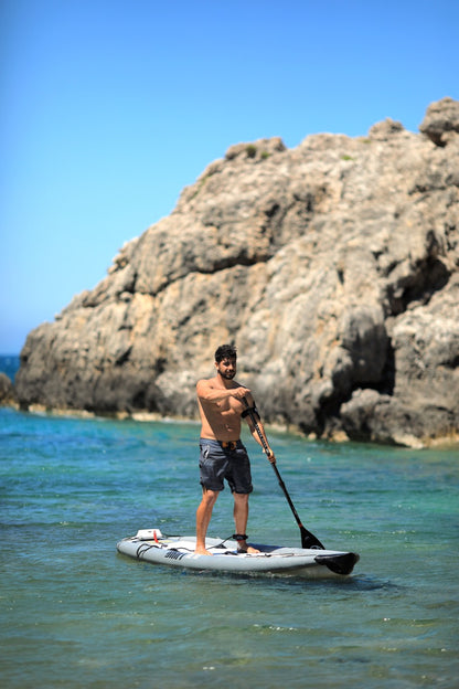 Fisherman on inflatable paddleboard isup paddlinge on the Drift by Aqua Marina. Rent fishing gear from MTBoarders.com with delivery included. Or buy now from e-boarders.com