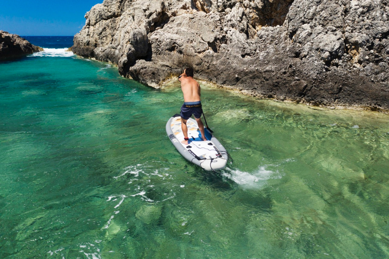 Fisherman on inflatable paddleboard isup paddling the Drift by Aqua Marina. Rent fishing gear from MTBoarders.com with delivery included. Or buy now from e-boarders.com