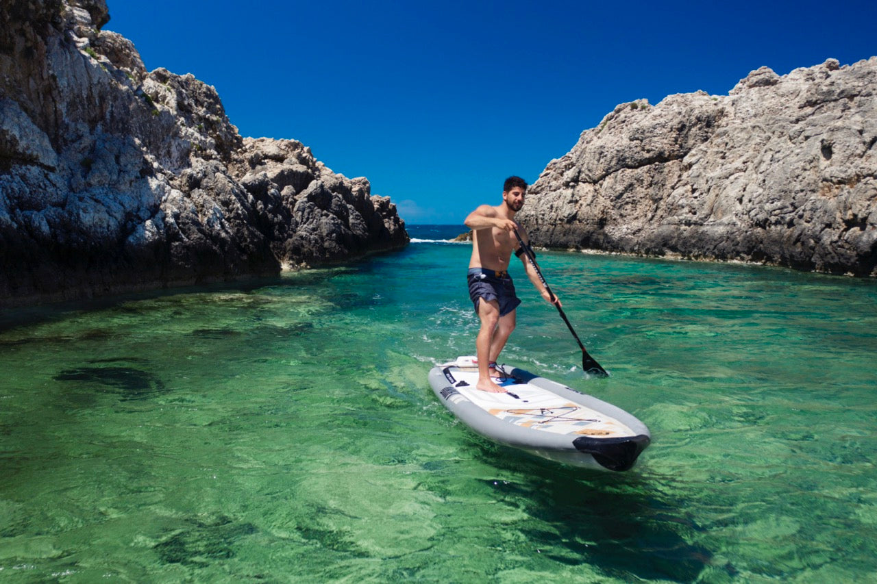 Fisherman on inflatable paddleboard isup Drift by Aqua Marina. Rent fishing gear from MTBoarders.com with delivery included. Or buy now from e-boarders.com