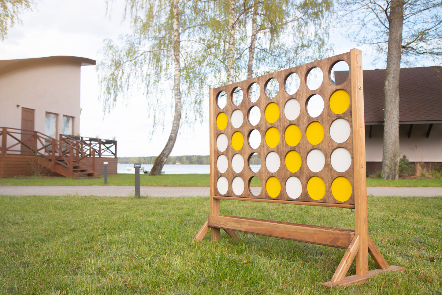 Giant Connect Four board game rental set up at Montana lake house by Montana Boarders. Rent with delivery or pickup for daily and weekend rentals.