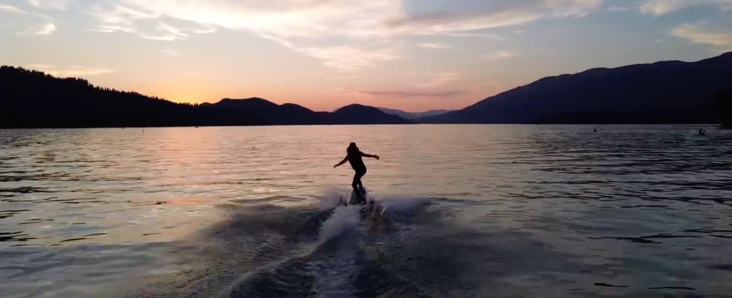 Libby jetboarding on Whitefish Lake, Montana with rental delivery company Montana Boarders