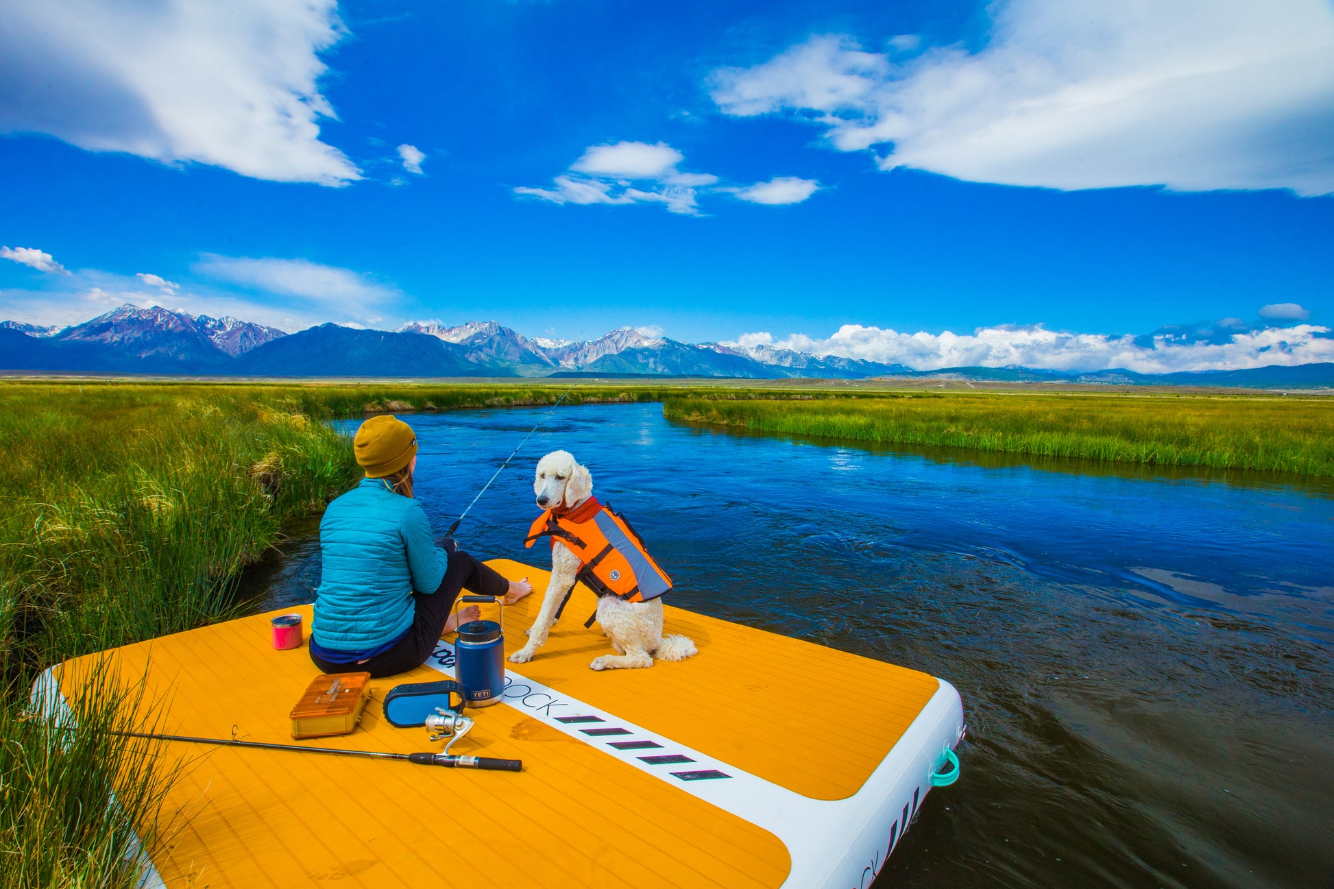 Inflatable lake furniture bundle rental with floating dock, lounge chairs, and table—delivered to waterfront properties in Flathead Valley, Montana. Rent from MontanaBoarders.com purchase from flagship partner eboarders.com