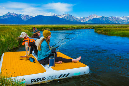 Inflatable lake furniture bundle rental with floating dock, lounge chairs, and table—delivered to waterfront properties in Flathead Valley, Montana. Rent from MontanaBoarders.com purchase from flagship partner eboarders.com