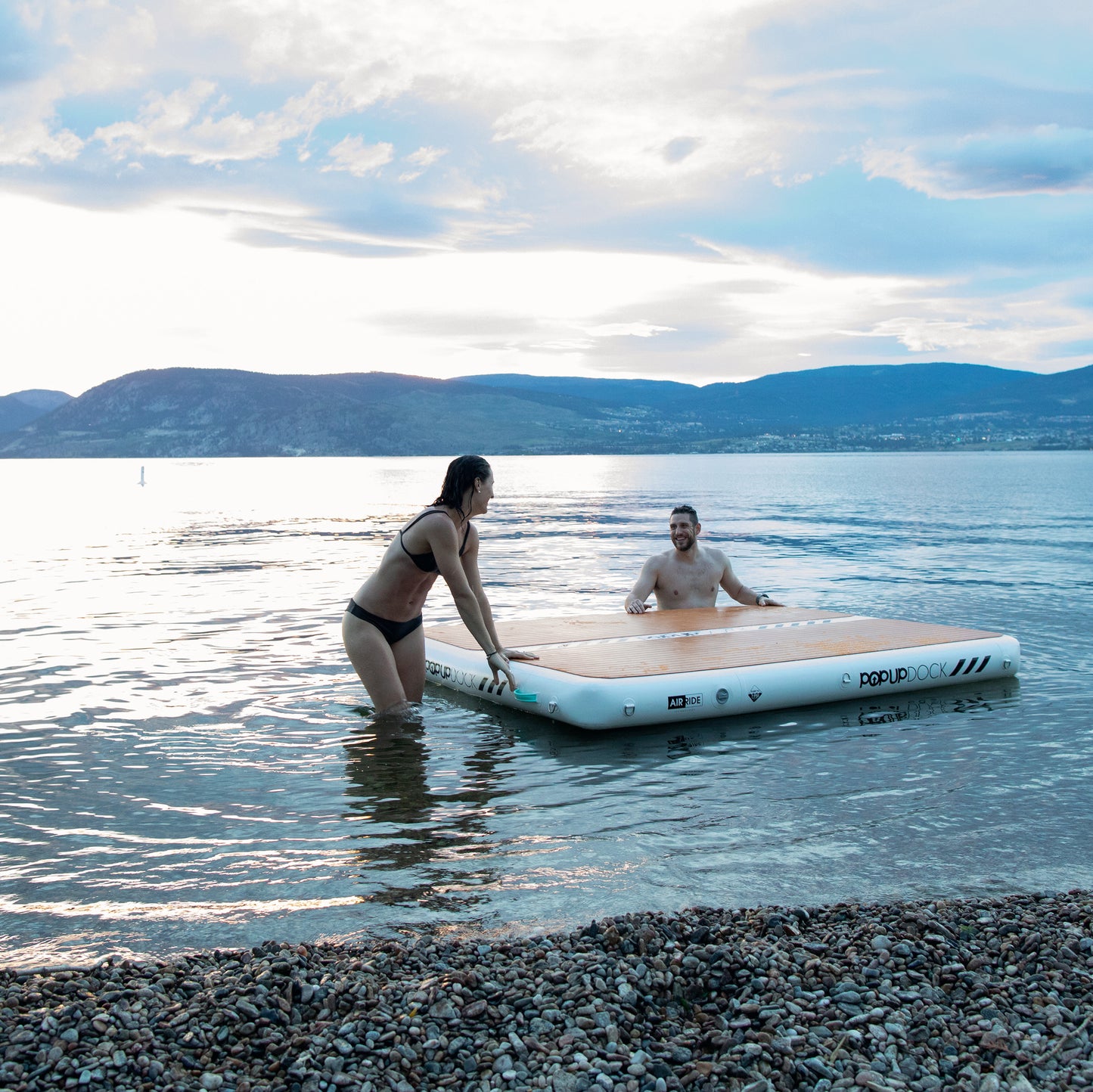 Inflatable lake furniture bundle rental with floating dock, lounge chairs, and table—delivered to waterfront properties in Flathead Valley, Montana. Rent from MontanaBoarders.com purchase from flagship partner eboarders.com