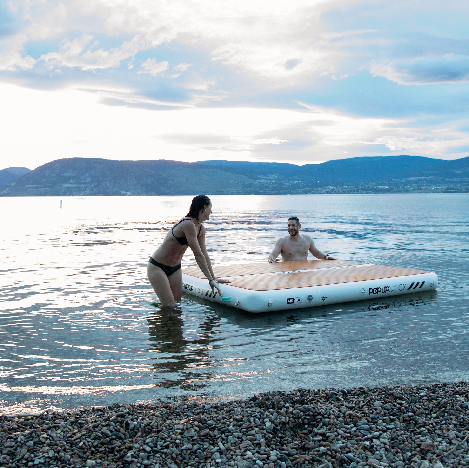 Inflatable lake furniture bundle rental with floating dock, lounge chairs, and table—delivered to waterfront properties in Flathead Valley, Montana. Rent from MontanaBoarders.com purchase from flagship partner eboarders.com