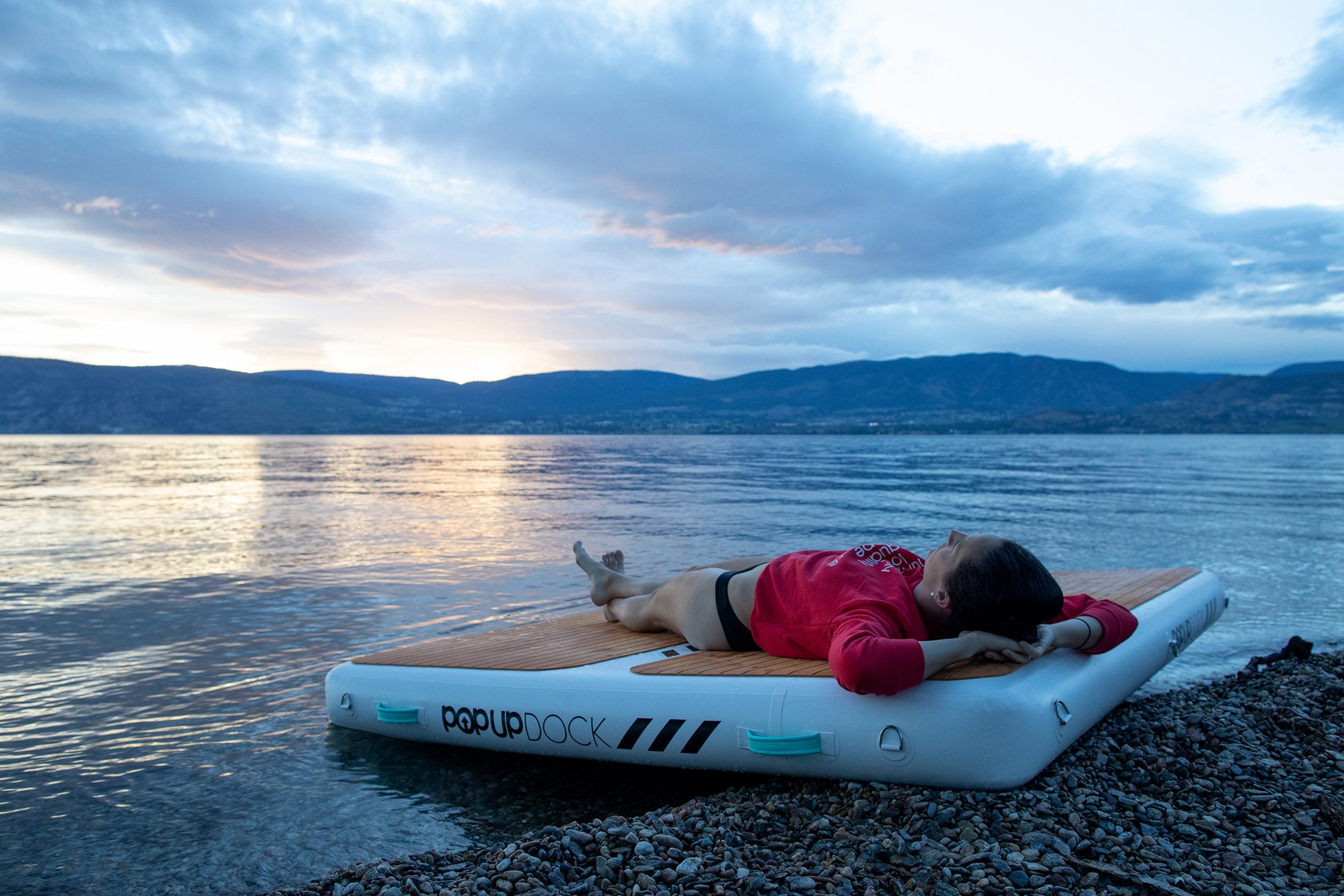 Inflatable lake furniture bundle rental with floating dock, lounge chairs, and table—delivered to waterfront properties in Flathead Valley, Montana. Rent from MontanaBoarders.com purchase from flagship partner eboarders.com