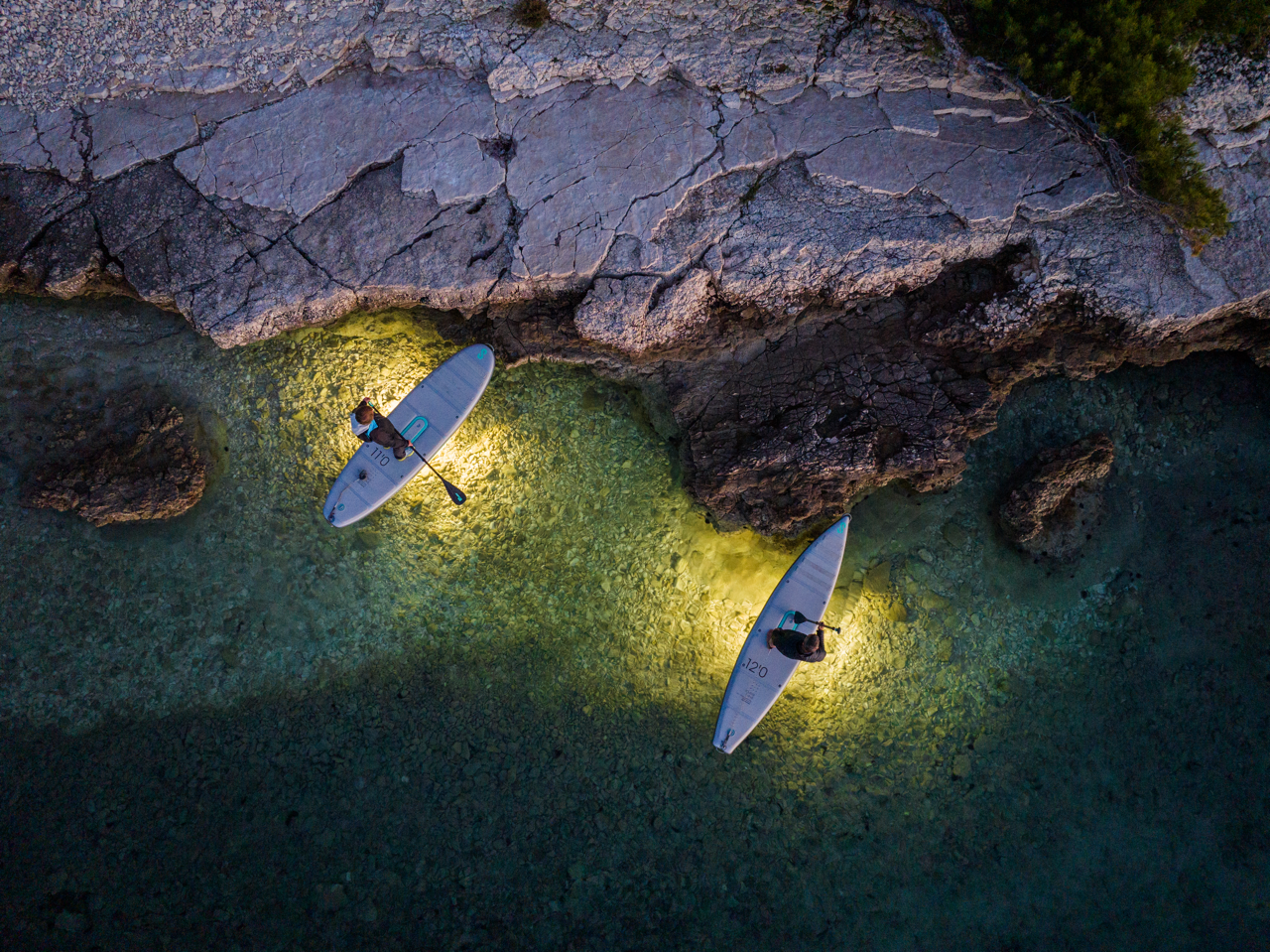 Rent LED illuminating SipaBoards self-inflating electric paddleboard rental with built-in propulsion and Bluetooth remote, delivered to Flathead Valley lakefronts. 